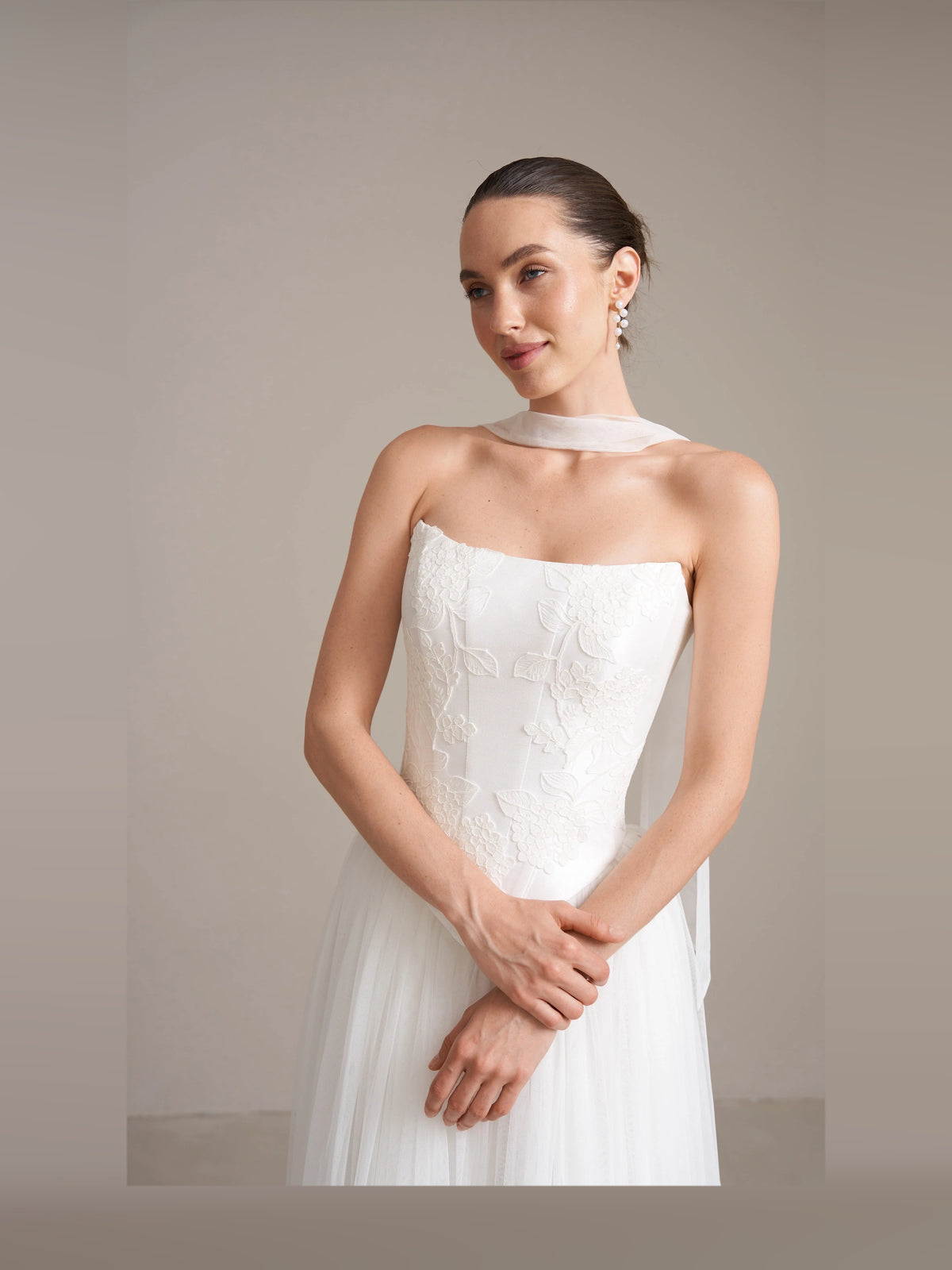 Ivory floor-length wedding dress, alternate view showing the skirt and hem