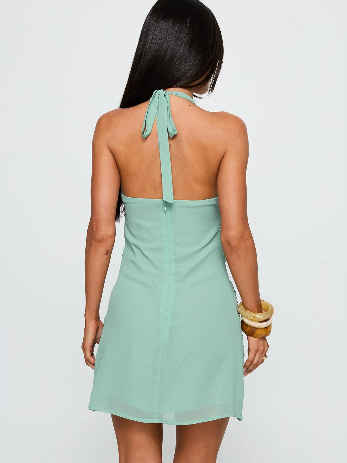 Green mini homecoming dress, alternate view showing the skirt and hem