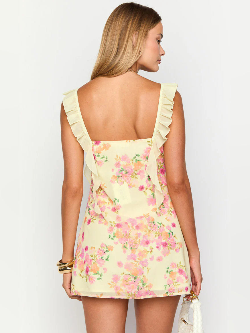 Yellow mini homecoming dress, alternate view showing the skirt and hem