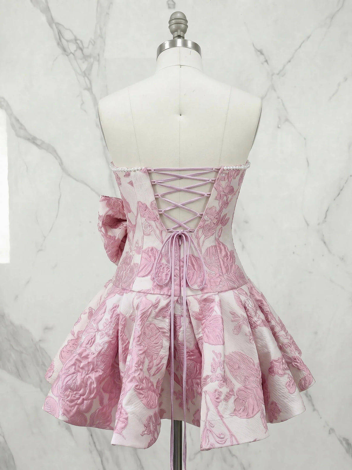 Pink mini homecoming dress, alternate view showing the skirt and hem