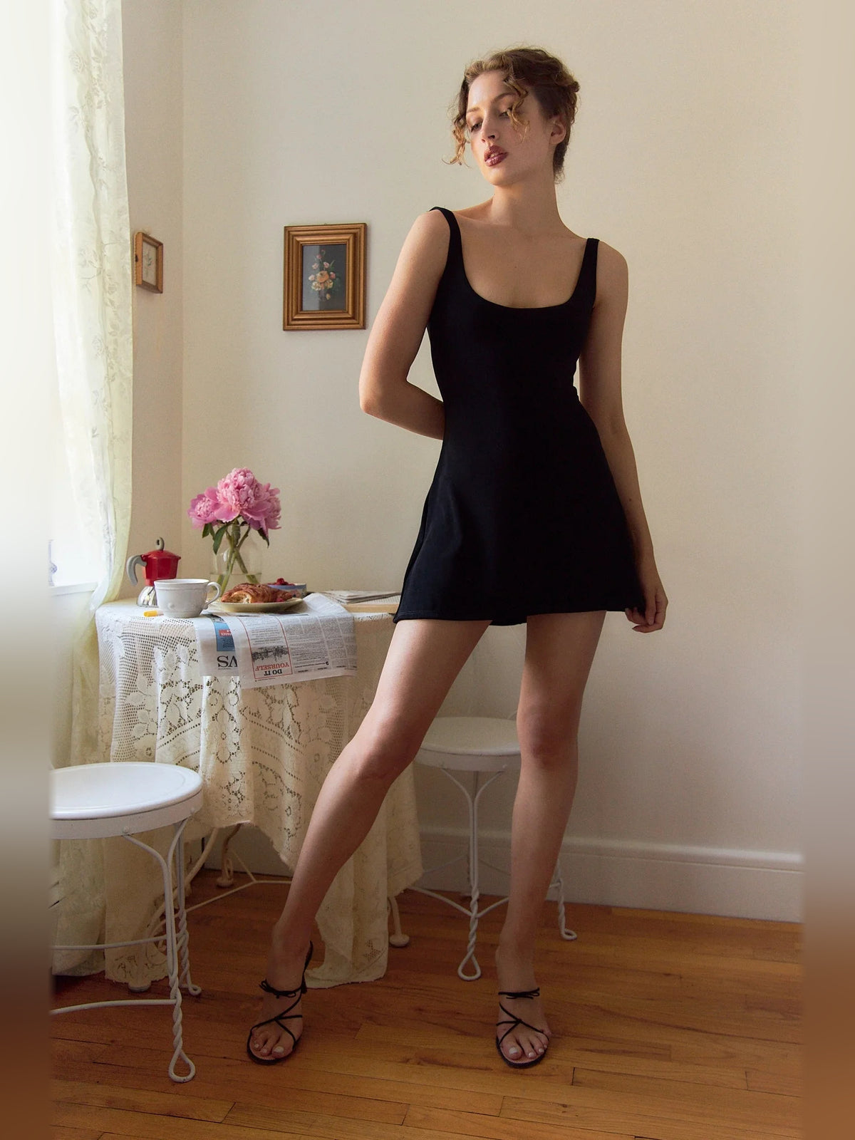 Black mini homecoming dress, alternate view showing the skirt and hem