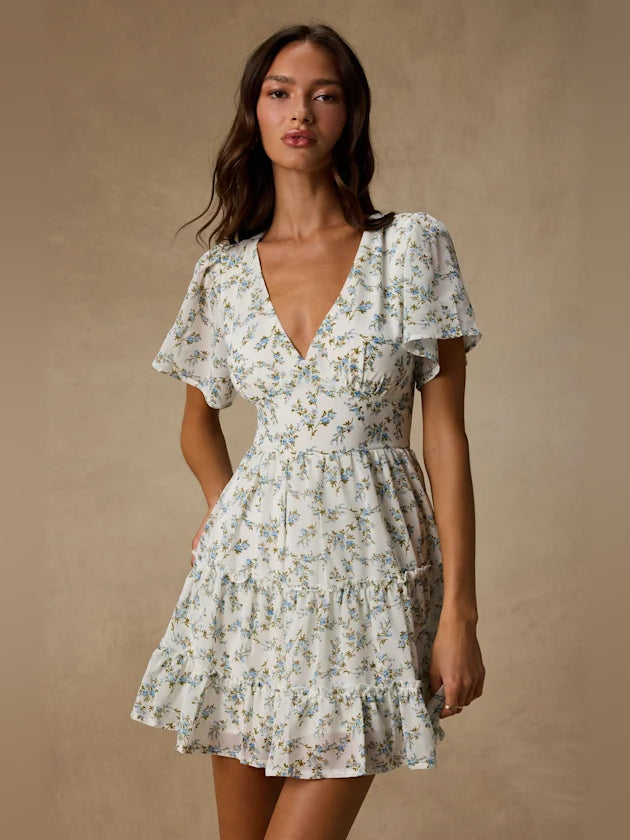 White Floral mini homecoming dress, alternate view showing the skirt and hem