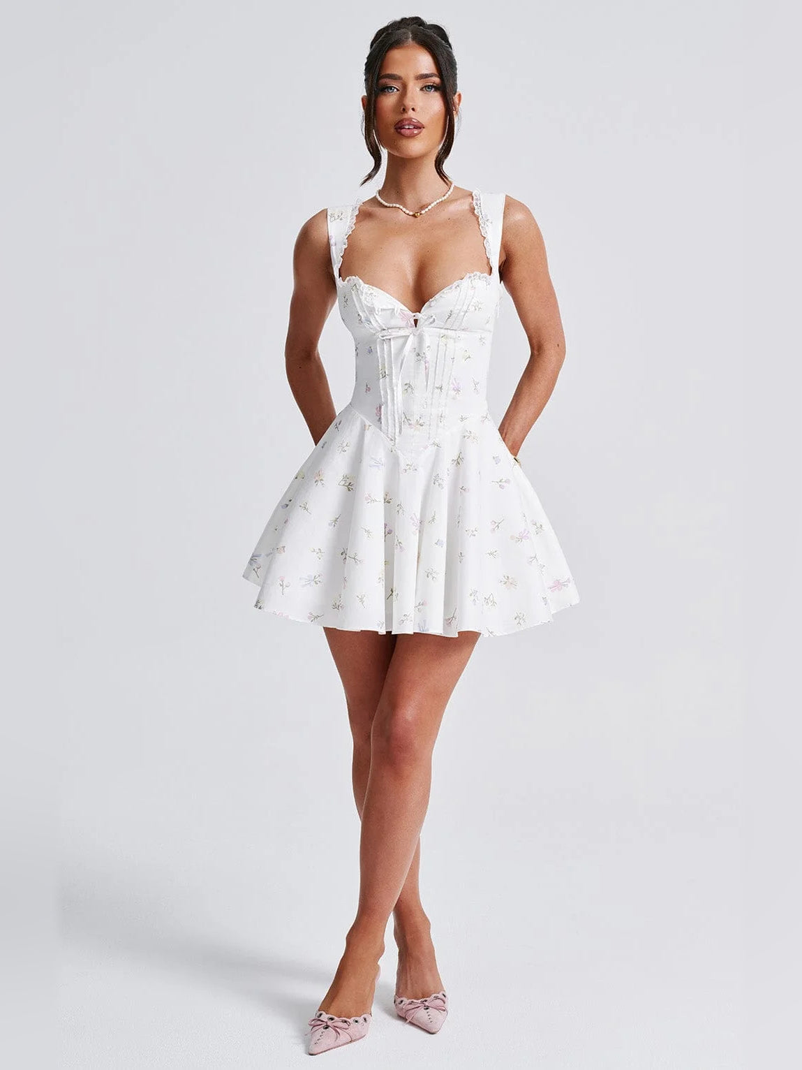 Floral mini homecoming dress, alternate view showing the skirt and hem