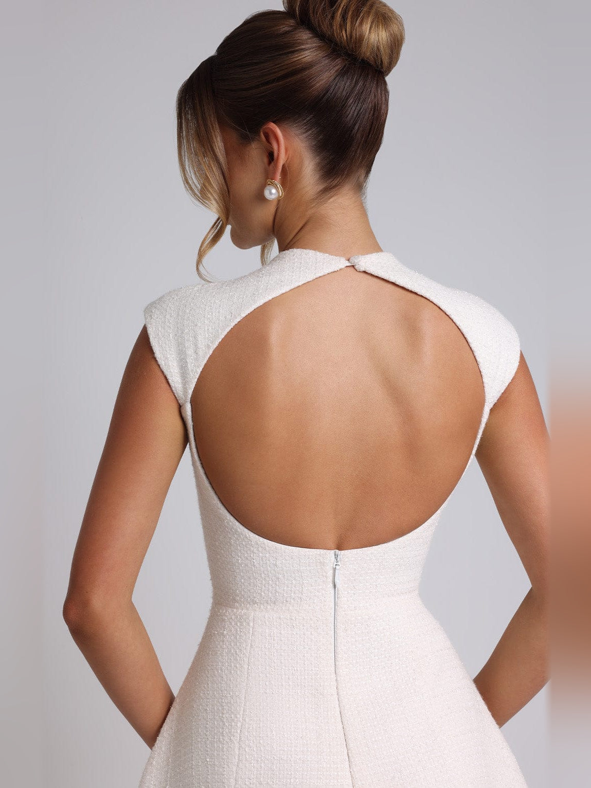 Ivory mini homecoming dress, alternate view showing the skirt and hem
