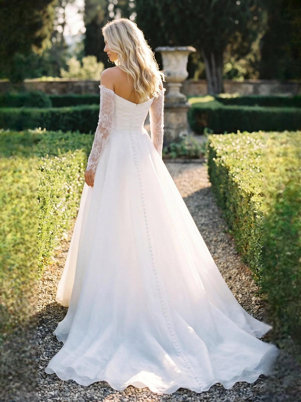 Ivory floor-length wedding dress, alternate view showing the skirt and hem