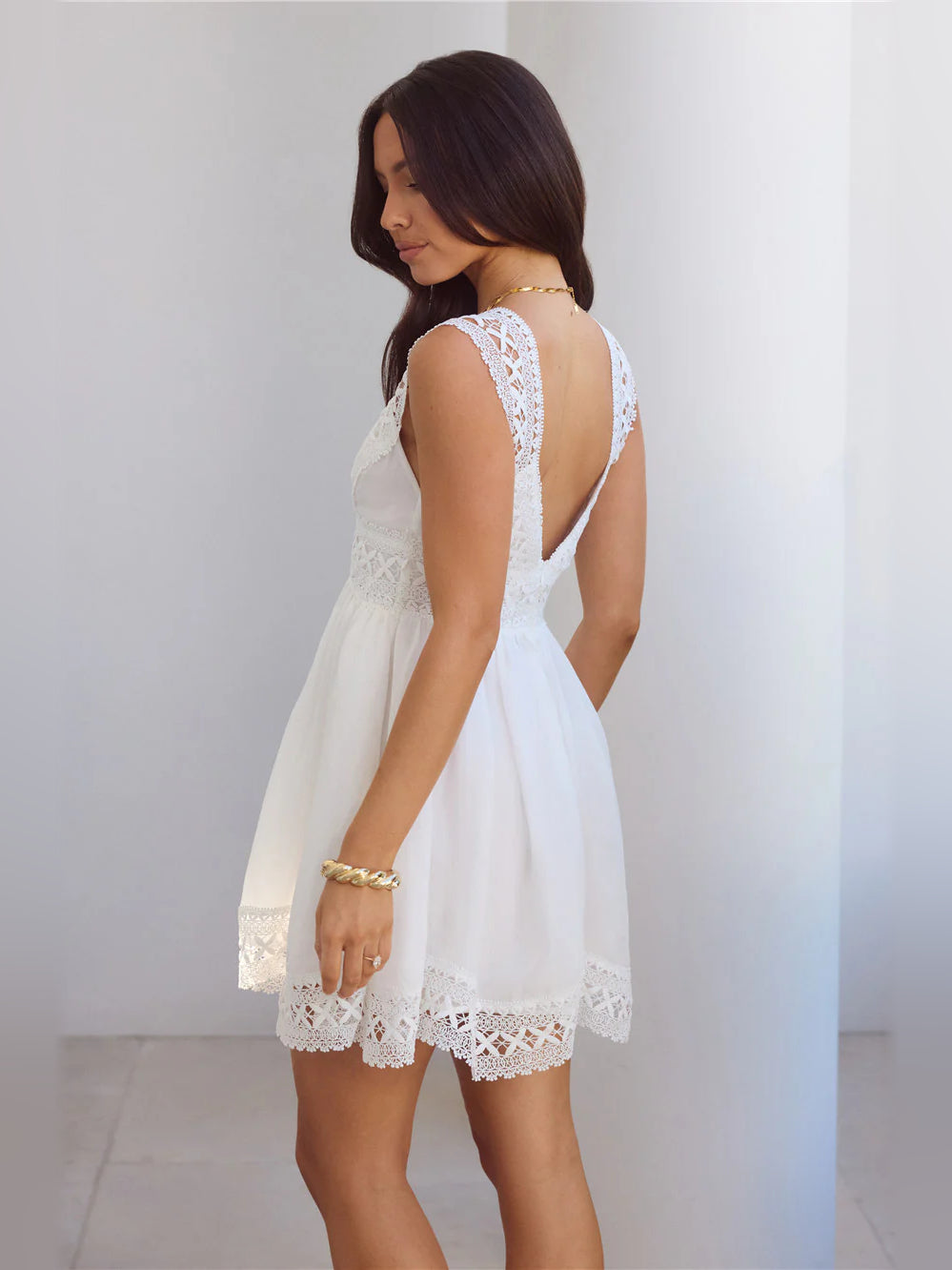 White mini homecoming dress, alternate view showing the skirt and hem
