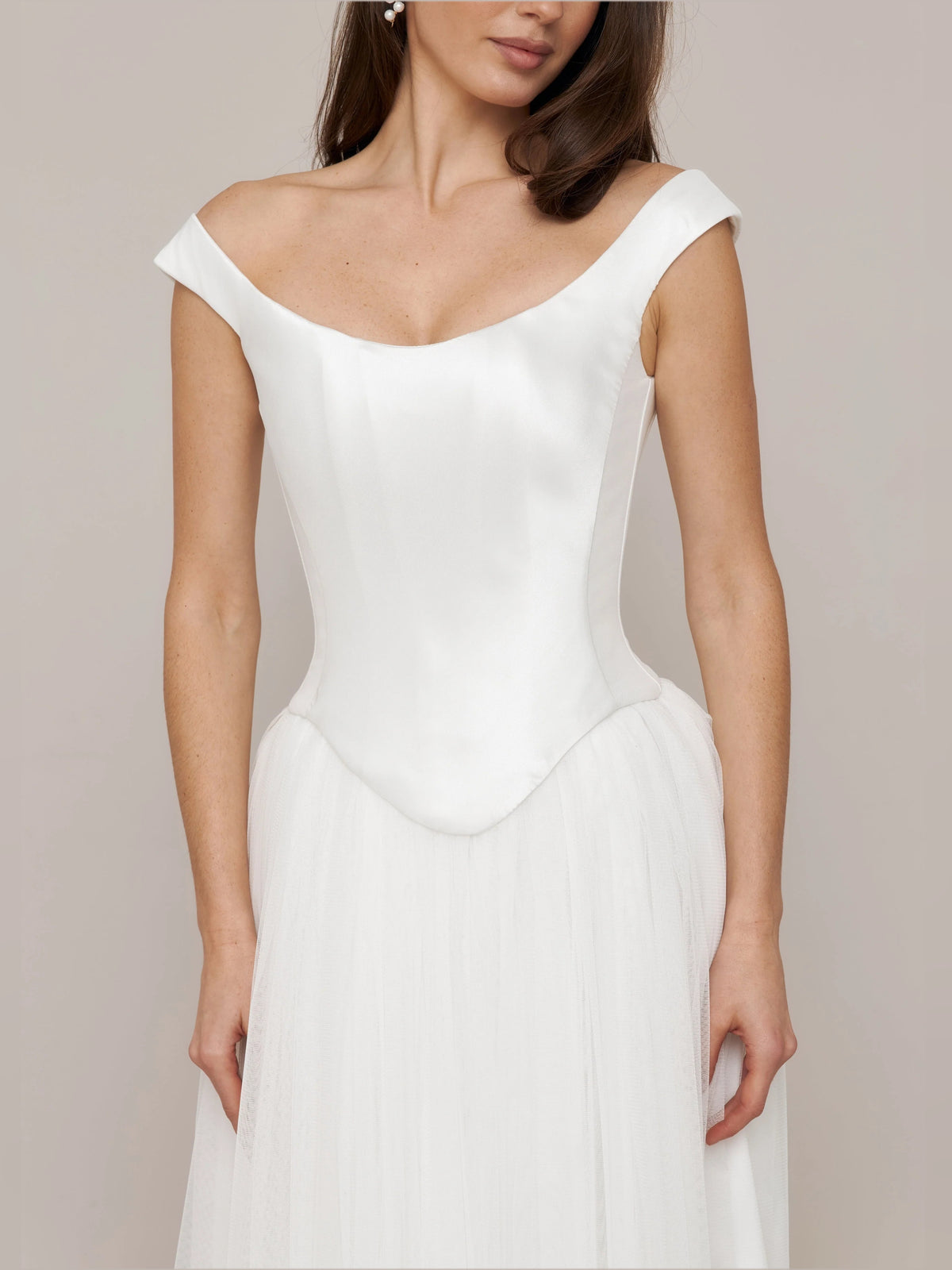 Ivory floor-length wedding dress, alternate view showing the skirt and hem