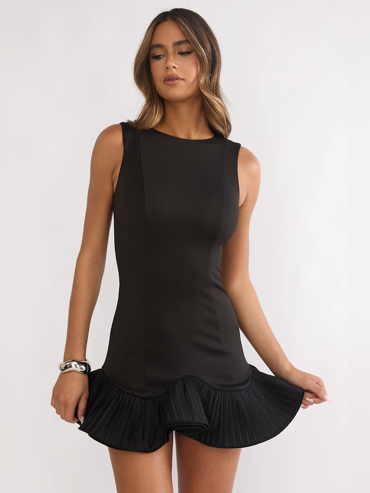 Black mini homecoming dress, alternate view showing the skirt and hem