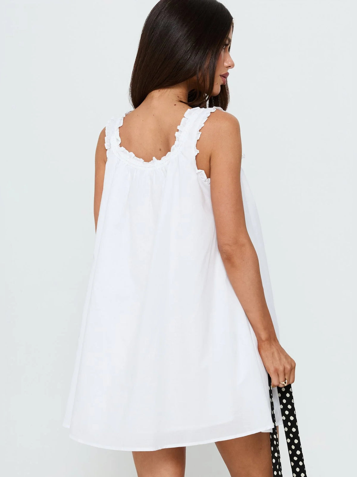 White mini homecoming dress, alternate view showing the skirt and hem