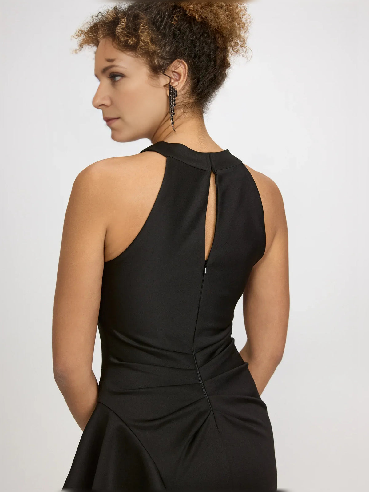 Black sheath floor-length formal dress with ruffle details, alternate view showing the skirt