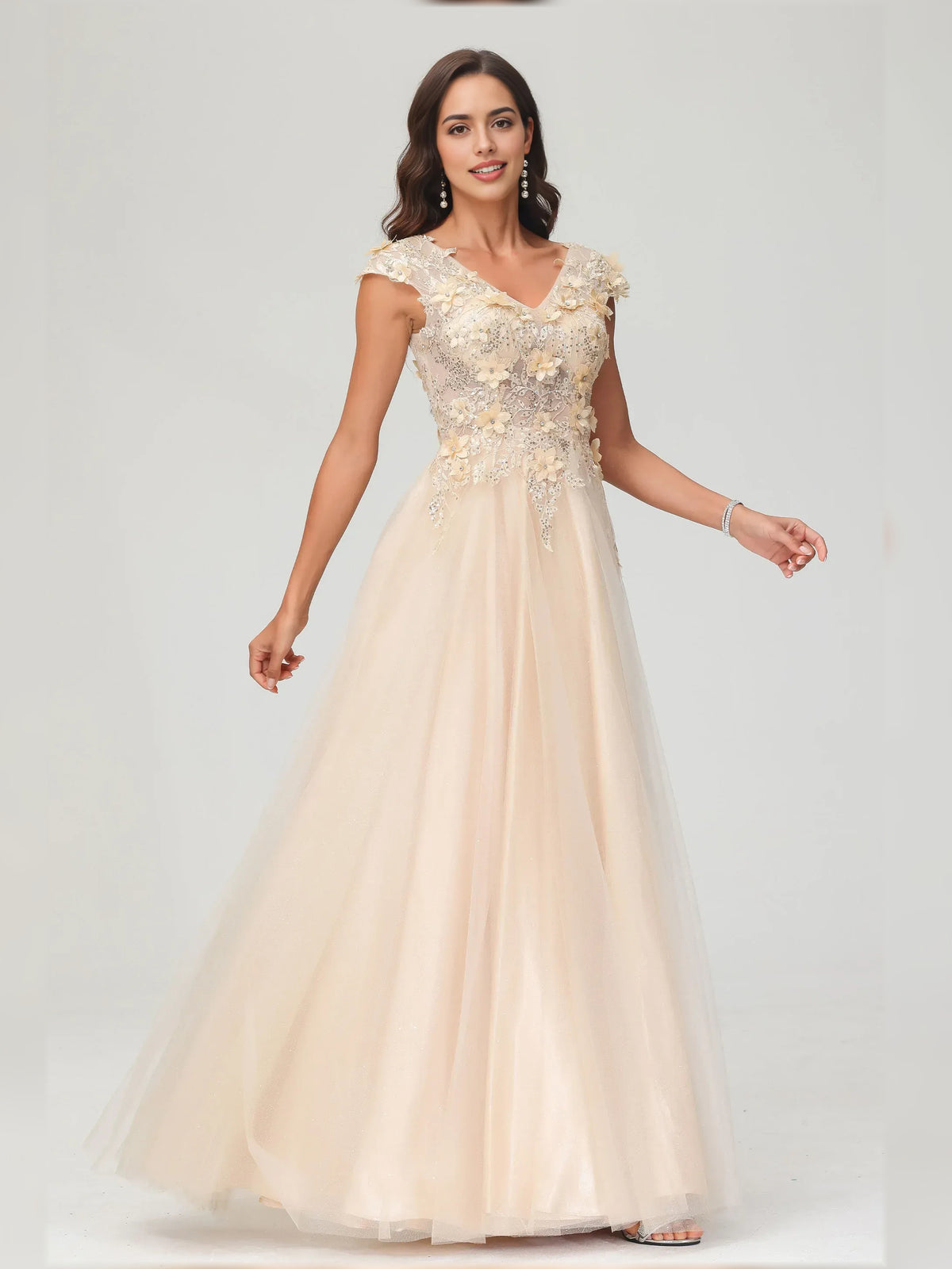 Champagne a-line floor-length formal dress with floral appliqué, alternate view showing the skirt