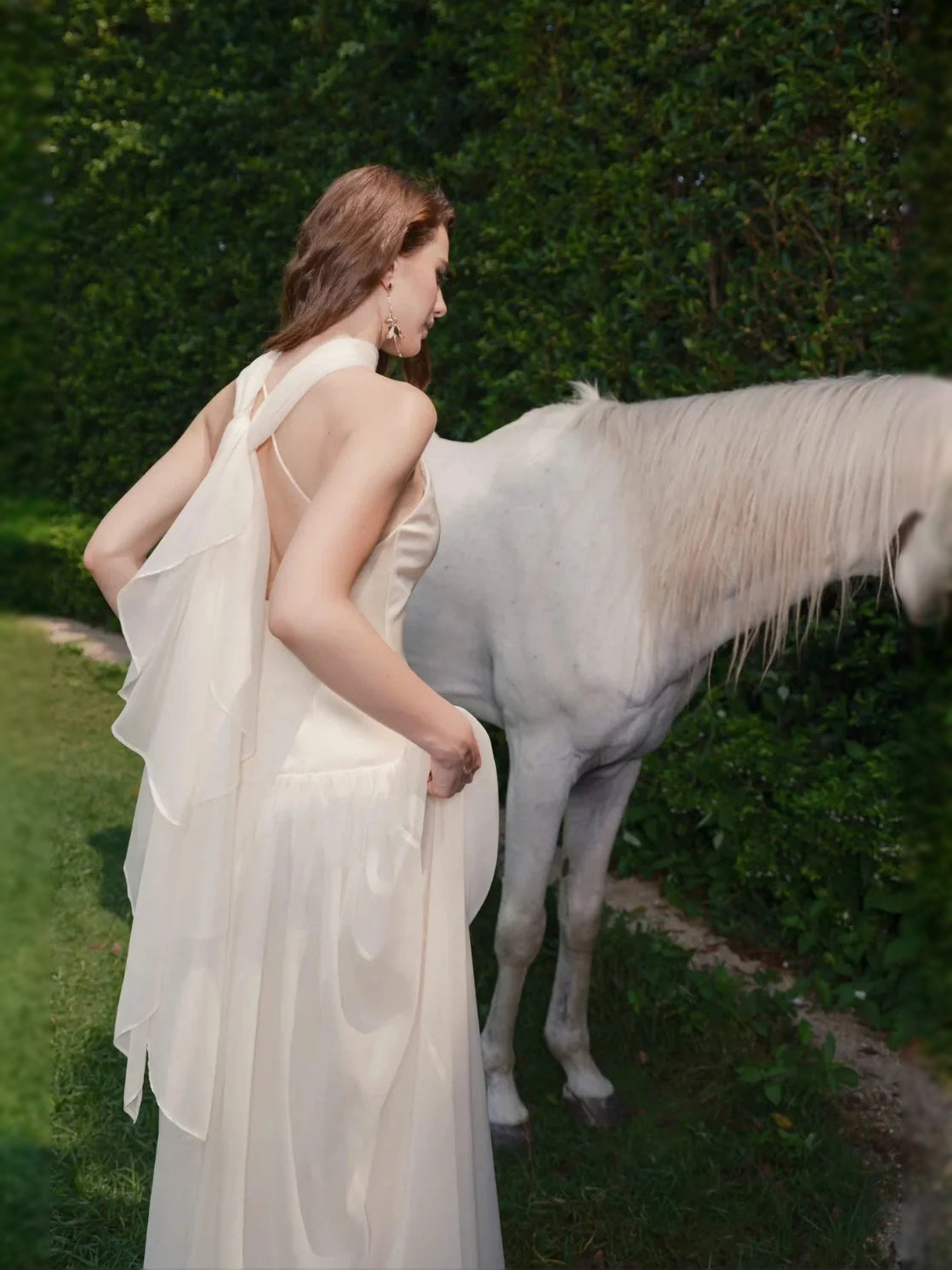 Ivory floor-length wedding dress, alternate view showing the skirt and hem