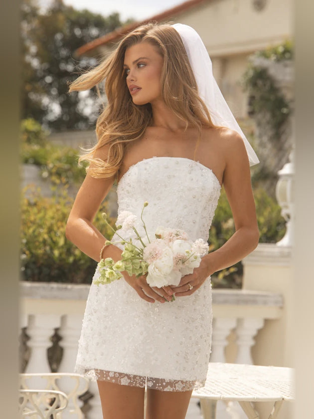 White mini homecoming dress, alternate view showing the skirt and hem