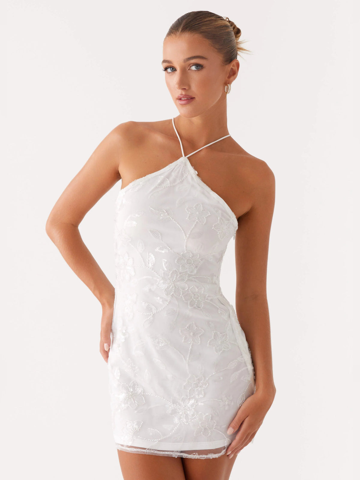 White mini homecoming dress, alternate view showing the skirt and hem