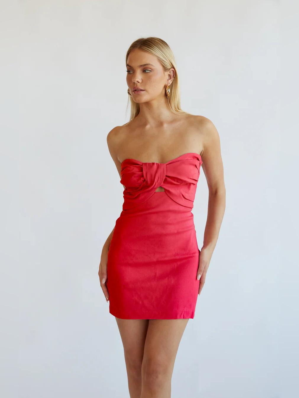 Orange mini homecoming dress, alternate view showing the skirt and hem