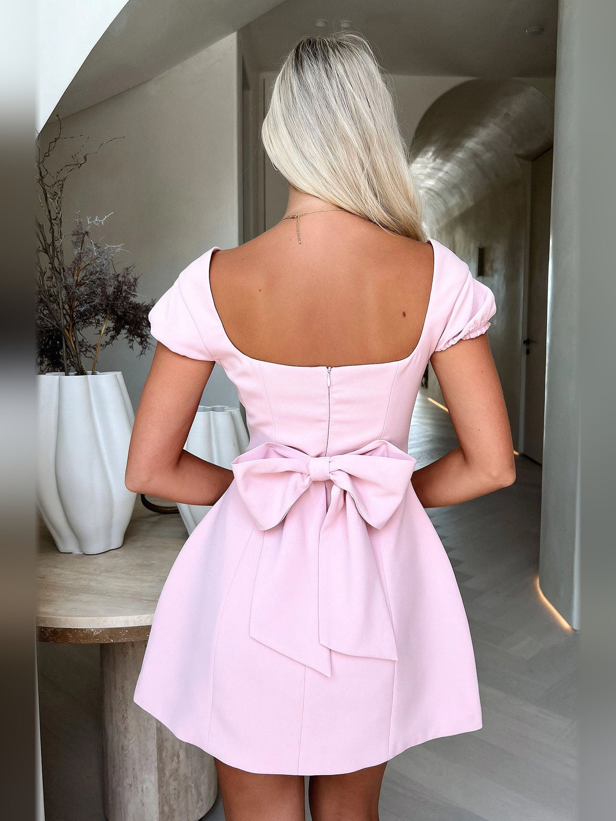 Ivory white mini homecoming dress, alternate view showing the skirt and hem