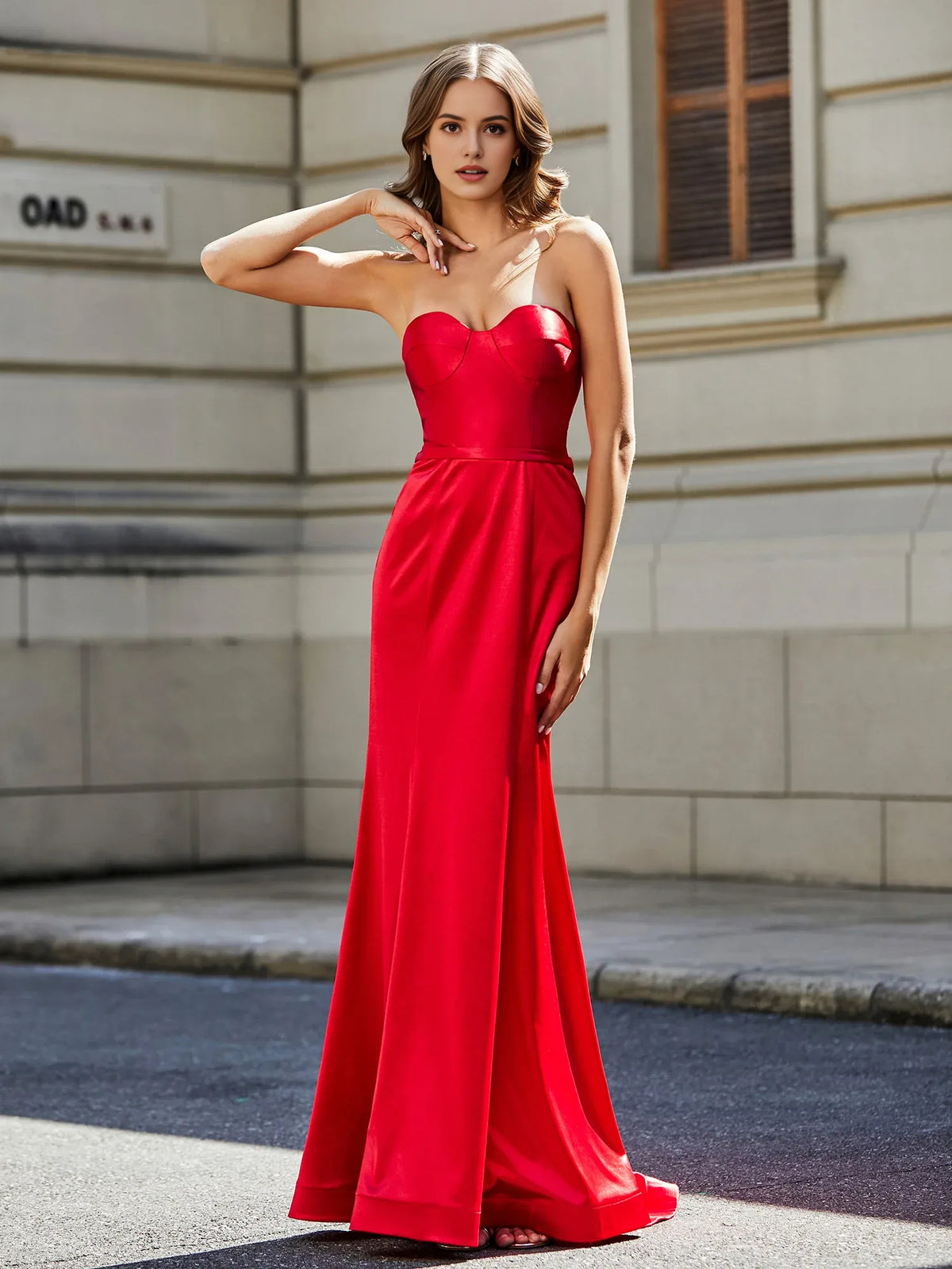 Red sheath floor-length formal dress with corset-style bodice, alternate view showing the skirt