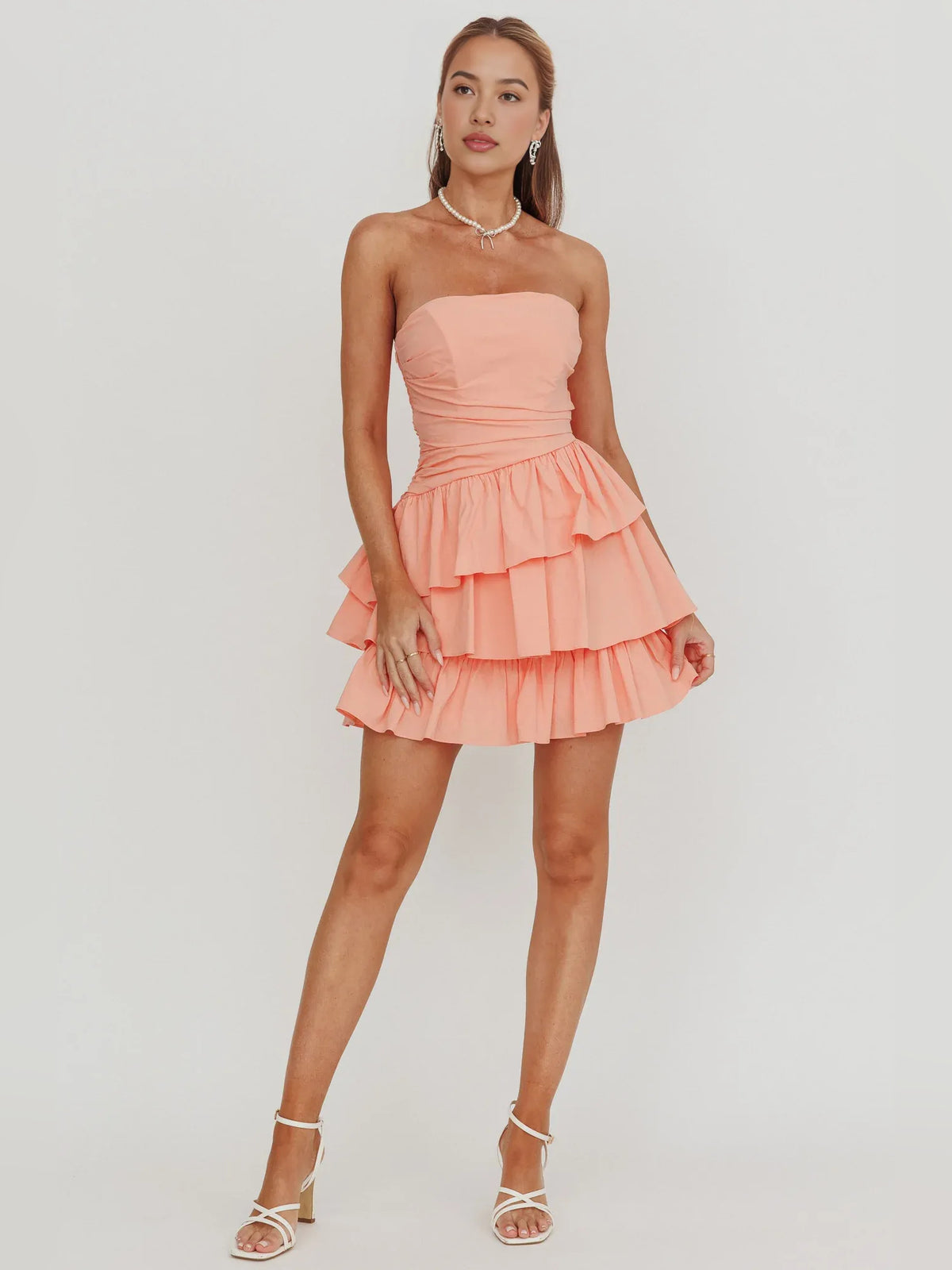 Ivory mini homecoming dress, alternate view showing the skirt and hem