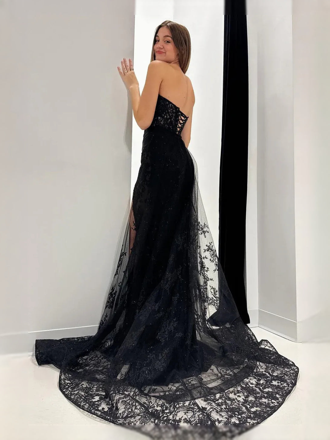Black maxi prom dress, alternate view showing the skirt and hem
