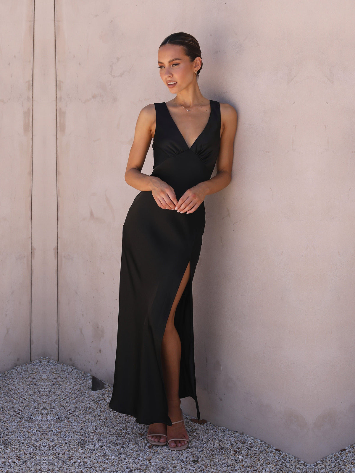 Black sheath maxi formal dress with skirt slit, alternate view showing the skirt