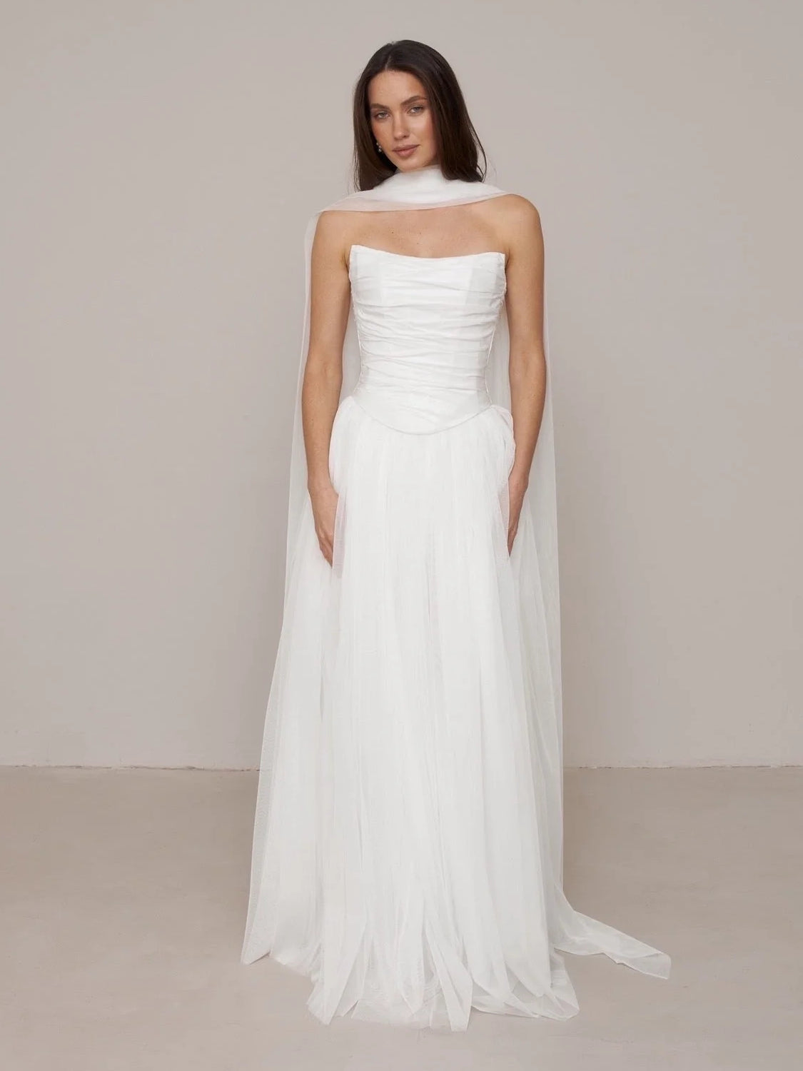 Ivory floor-length wedding dress, alternate view showing the skirt and hem