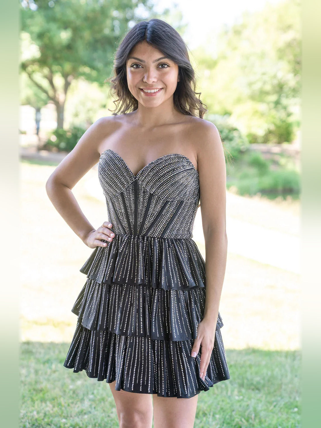 Black mini homecoming dress, alternate view showing the skirt and hem