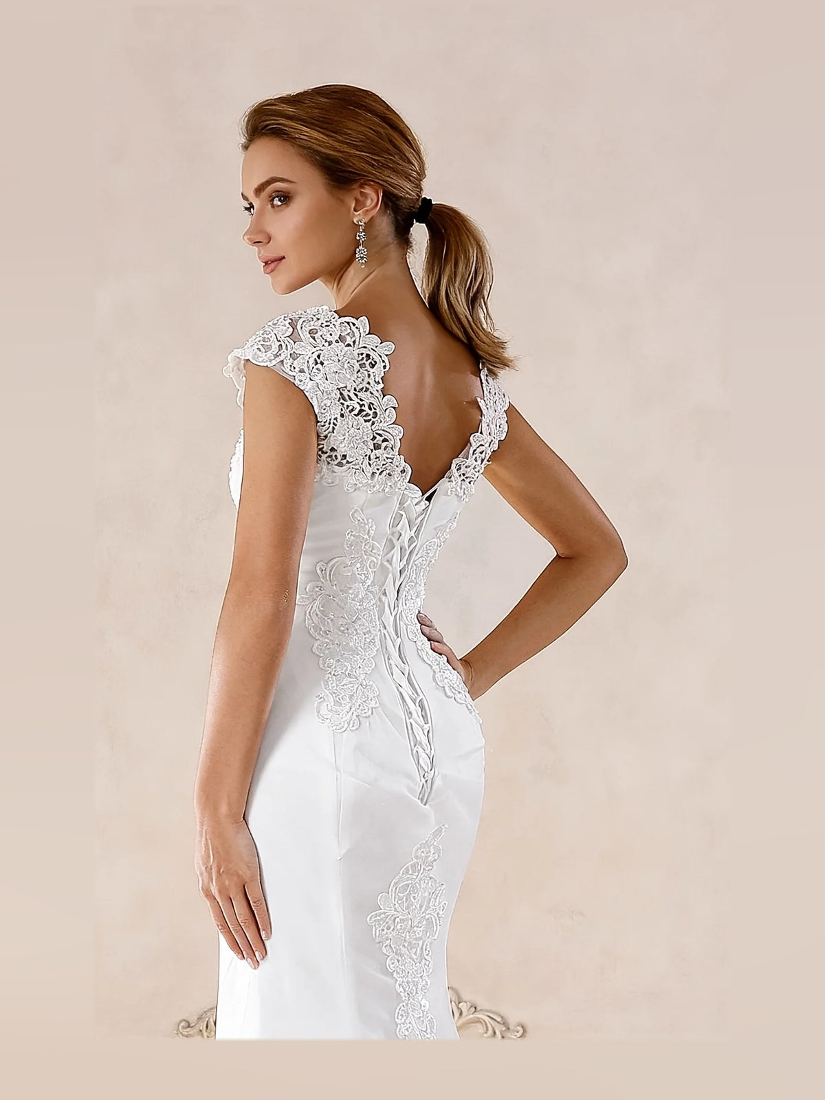 Ivory floor-length wedding dress, alternate view showing the skirt and hem
