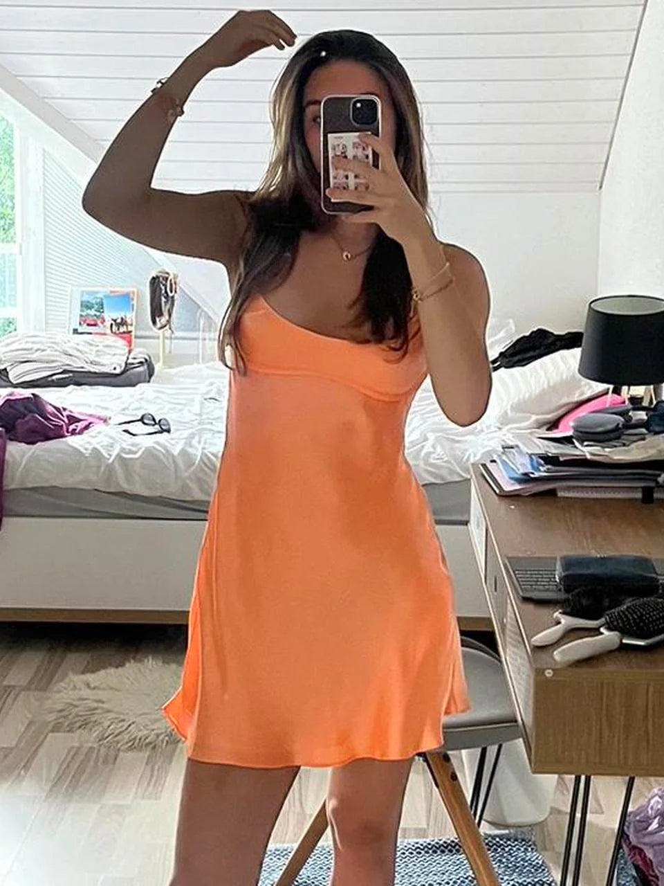 Orange mini homecoming dress, alternate view showing the skirt and hem