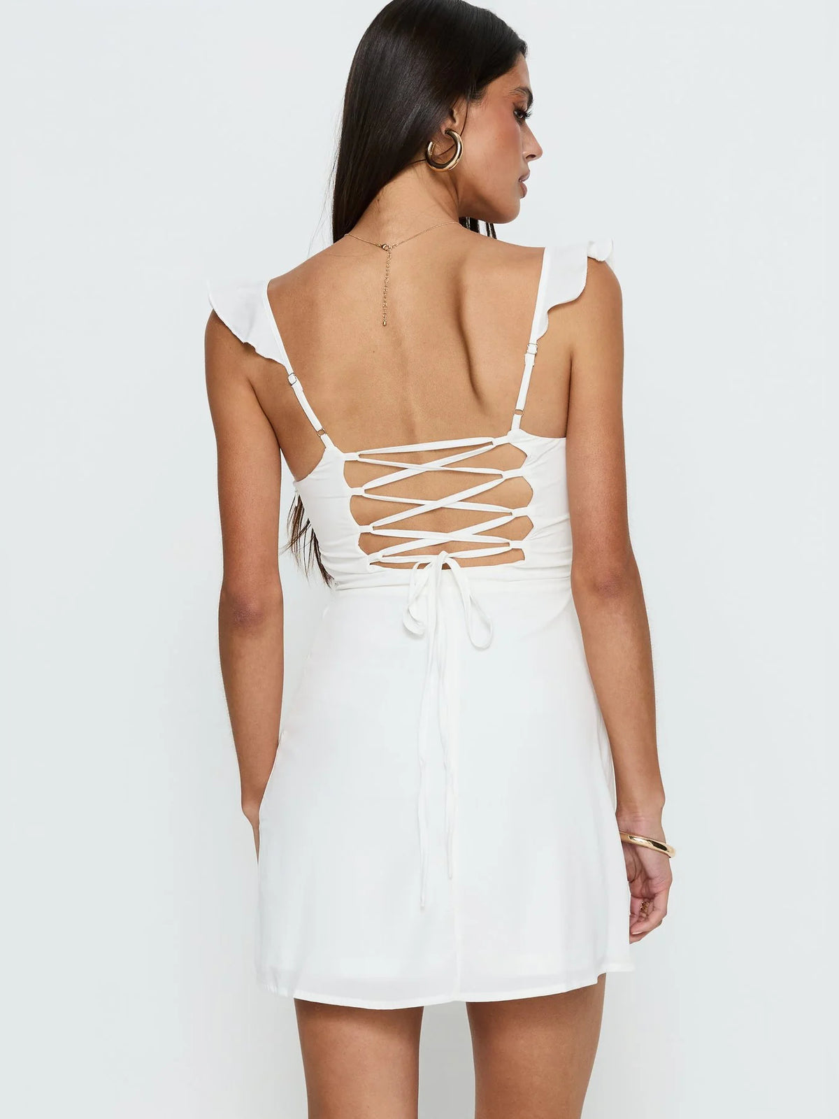 White mini homecoming dress, alternate view showing the skirt and hem