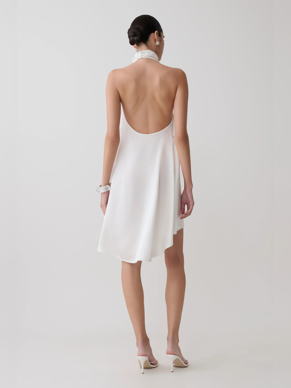 Ivory mini homecoming dress, alternate view showing the skirt and hem