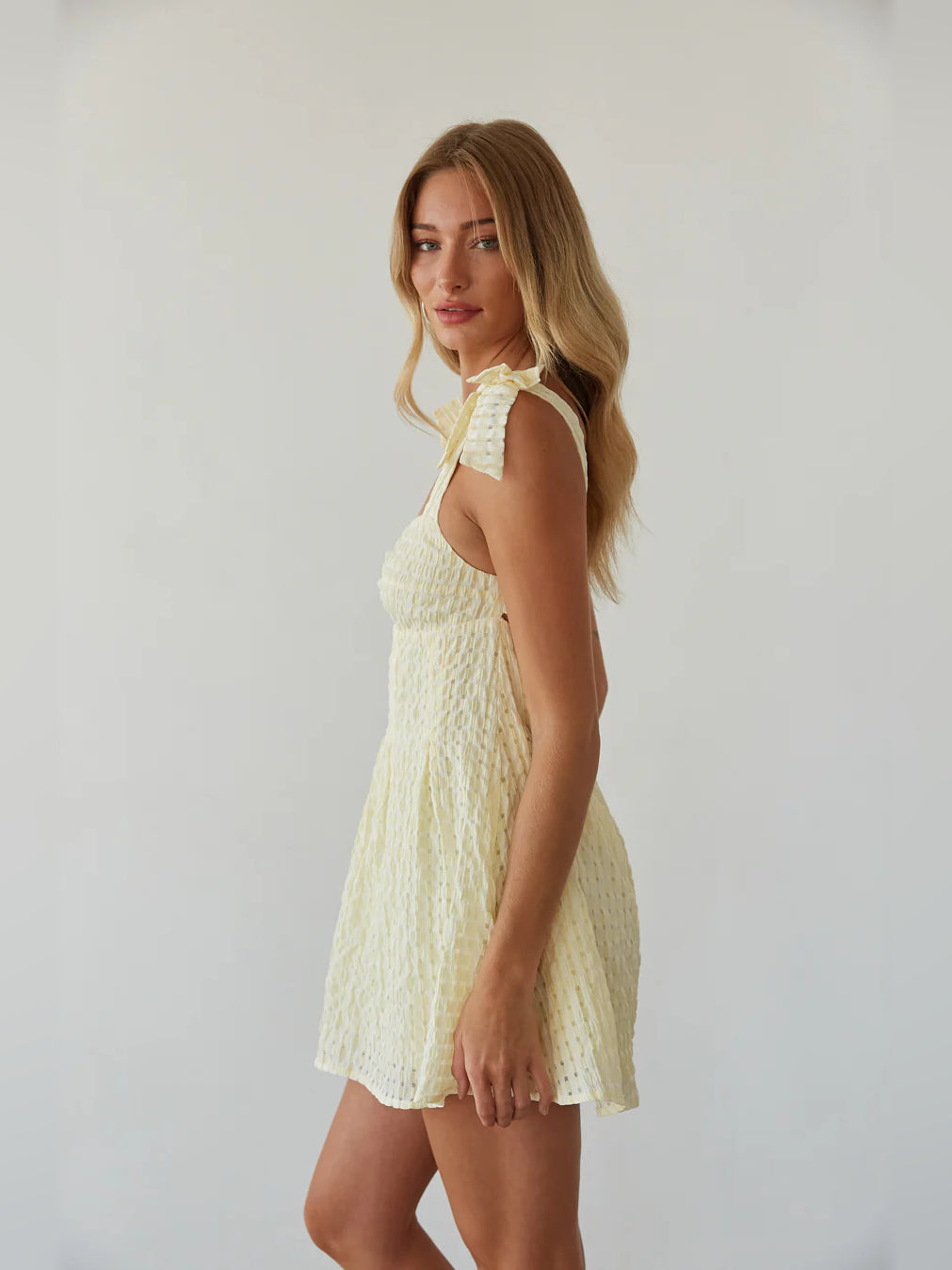 Gold mini homecoming dress, alternate view showing the skirt and hem