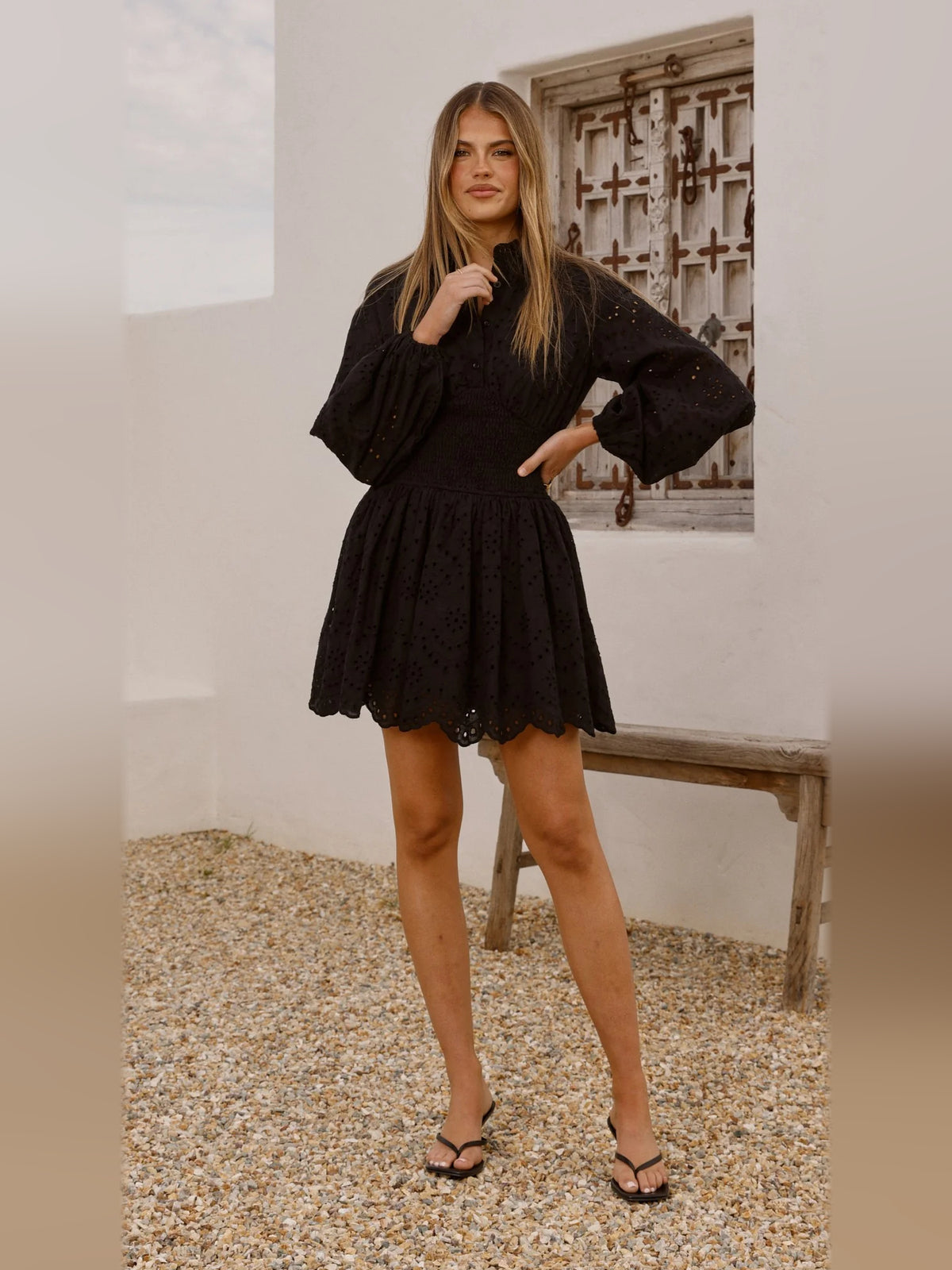 Black mini homecoming dress, alternate view showing the skirt and hem