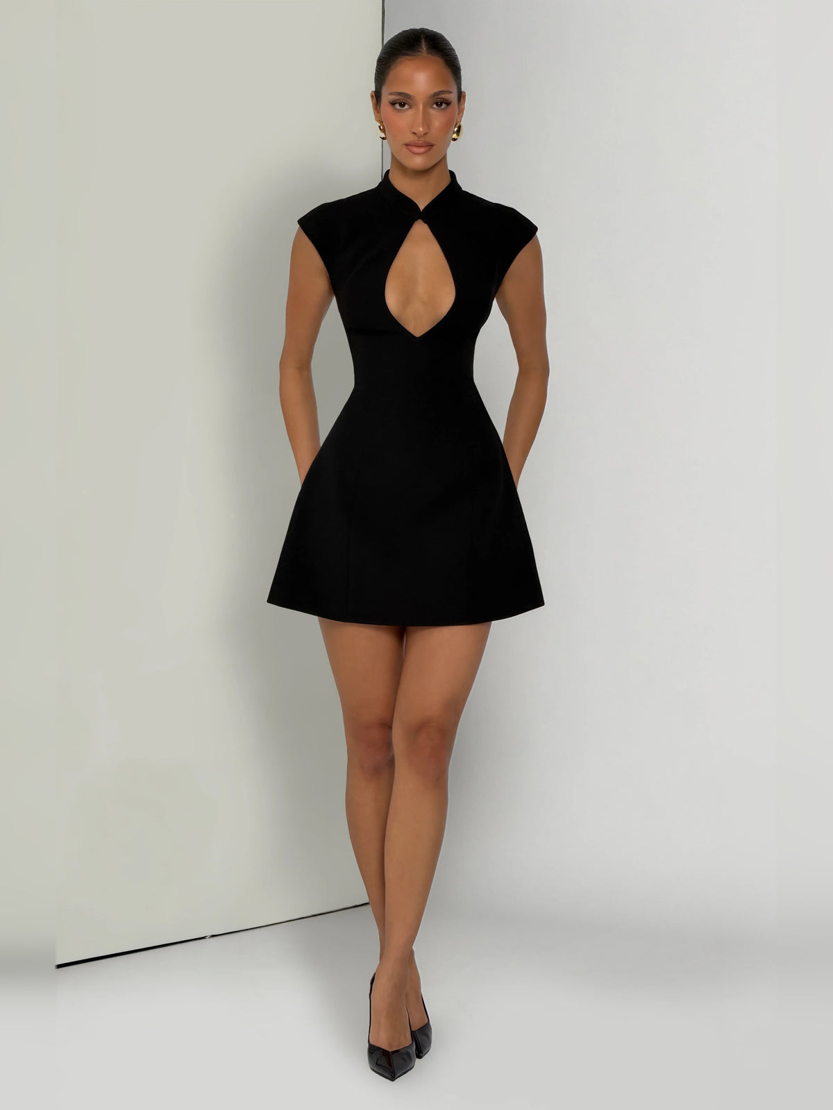 Black mini homecoming dress, alternate view showing the skirt and hem