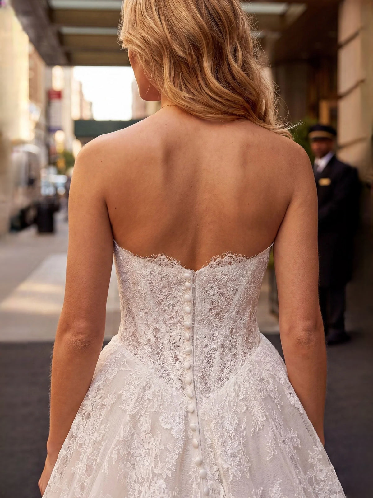 Ivory floor-length wedding dress, alternate view showing the skirt and hem