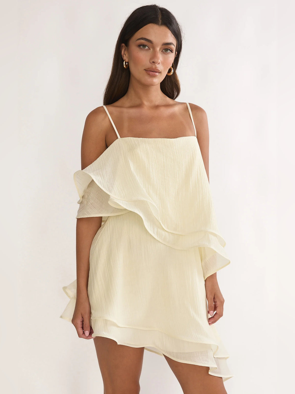 Cream mini homecoming dress, alternate view showing the skirt and hem