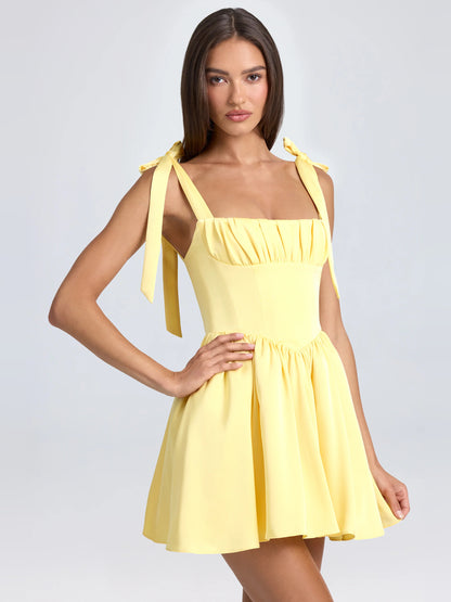Yellow mini homecoming dress, alternate view showing the skirt and hem