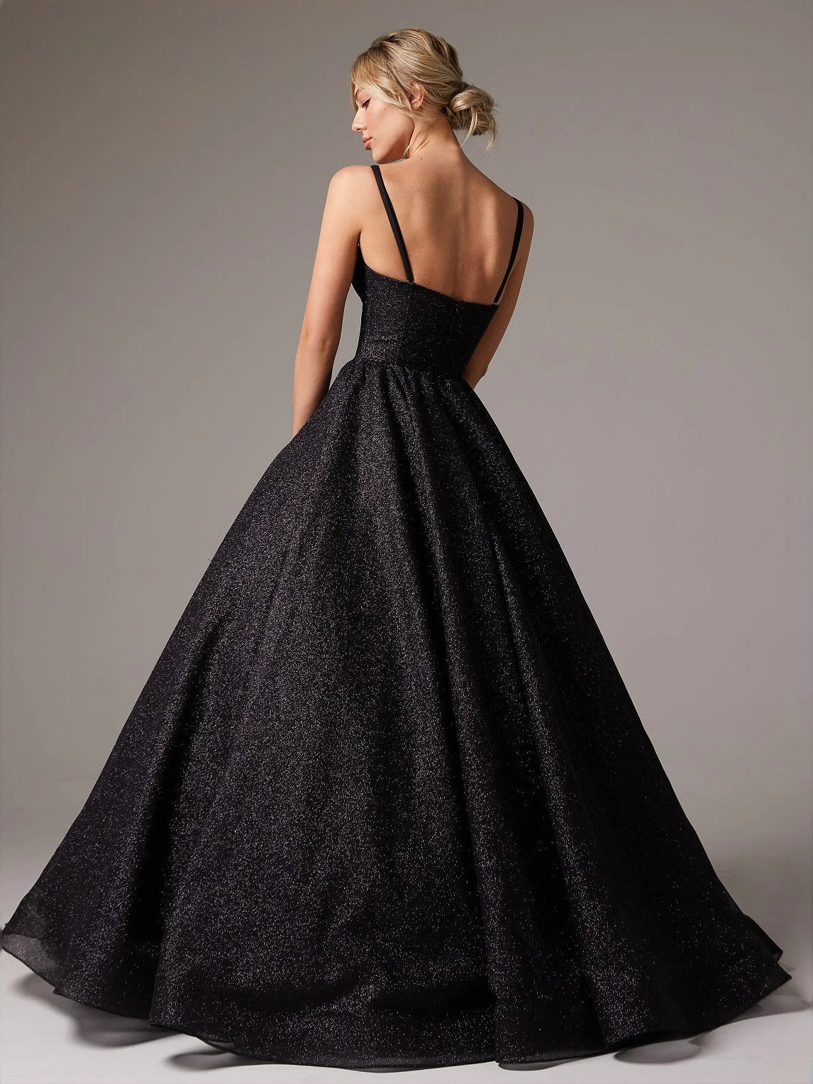 Black floor-length prom dress, alternate view showing the skirt and hem
