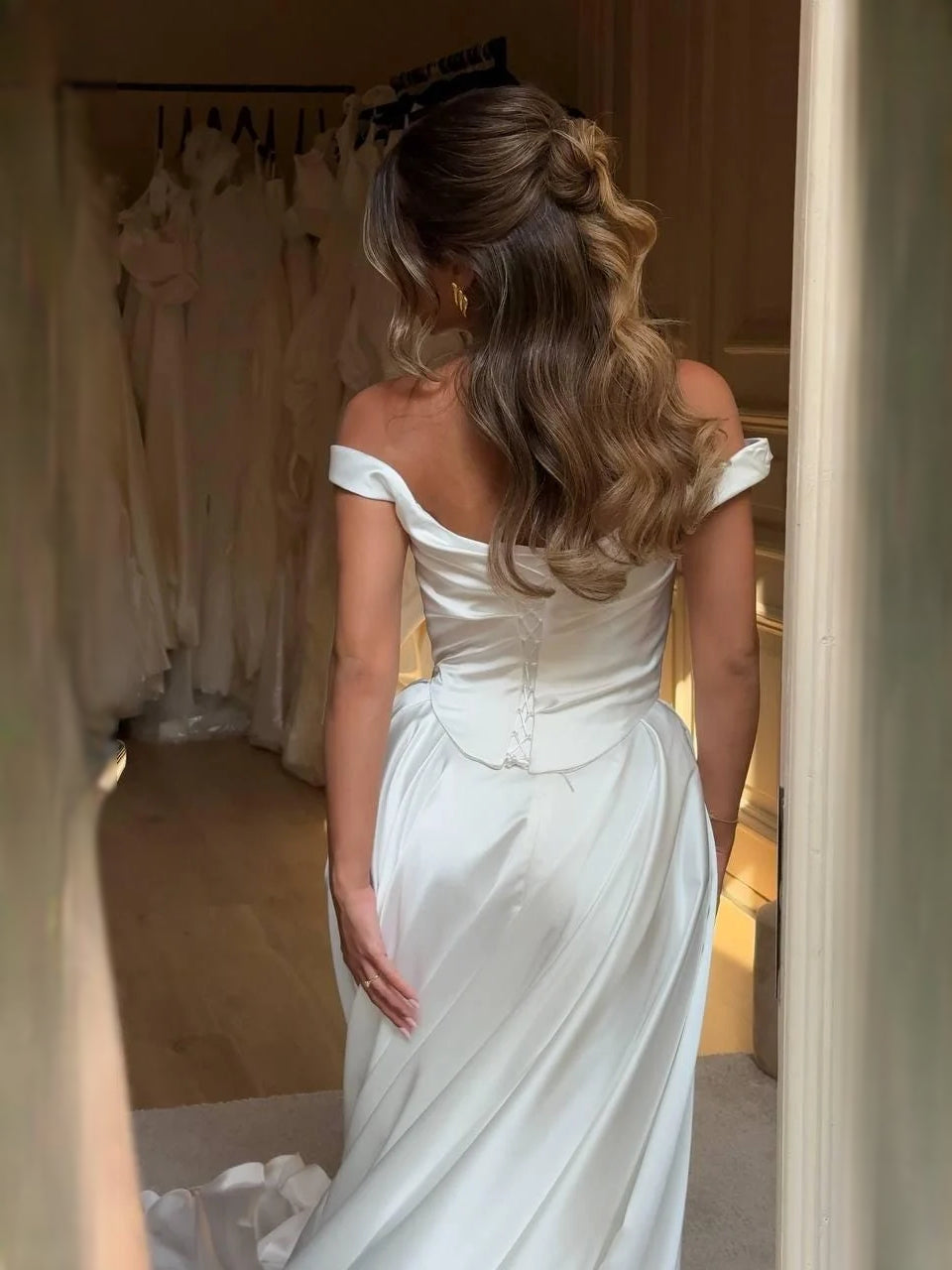 Ivory floor-length wedding dress, alternate view showing the skirt and hem