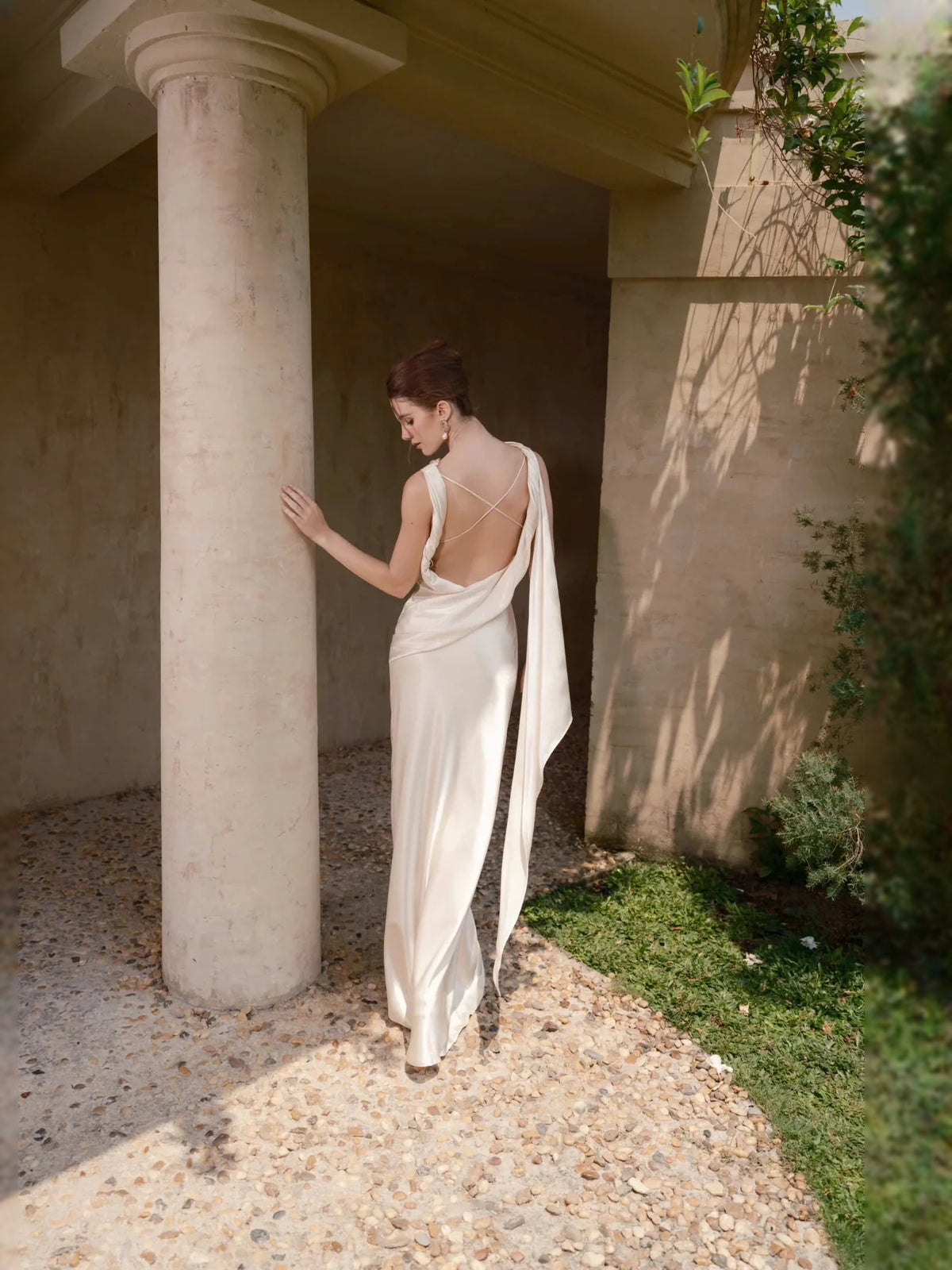 Ivory floor-length wedding dress, alternate view showing the skirt and hem