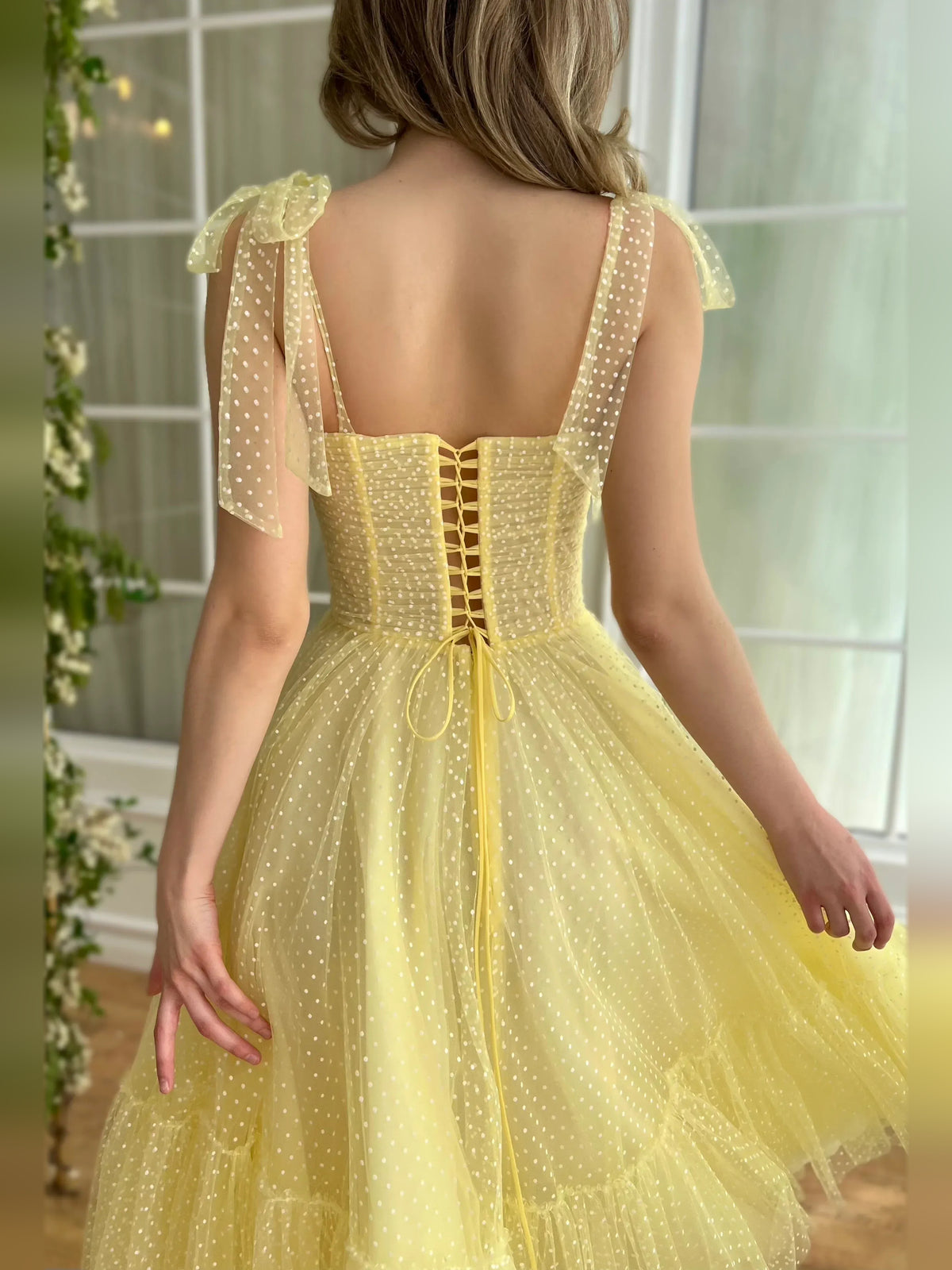 Yellow tea-length homecoming dress, alternate view showing the skirt and hem