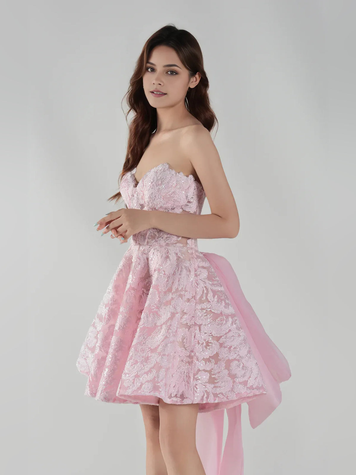Light Pink mini homecoming dress, alternate view showing the skirt and hem