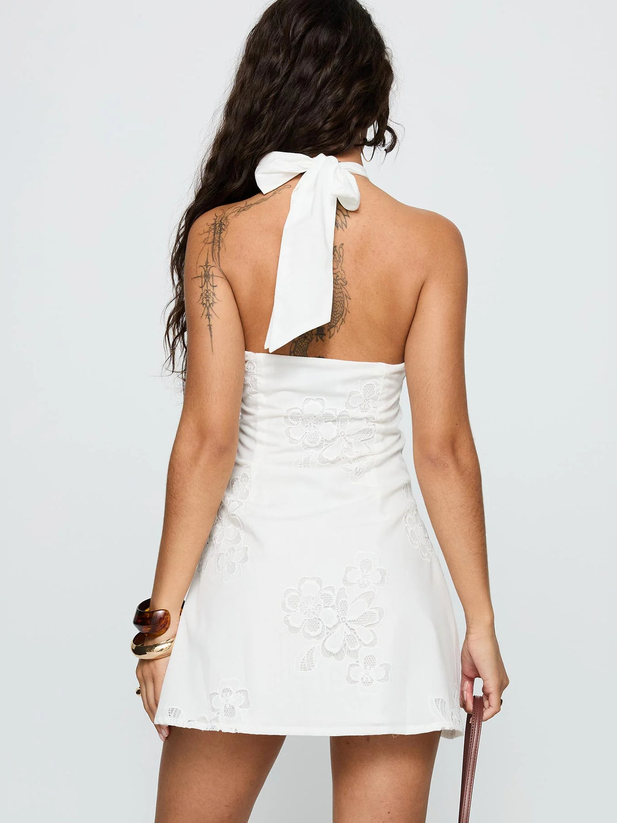 White mini homecoming dress, alternate view showing the skirt and hem
