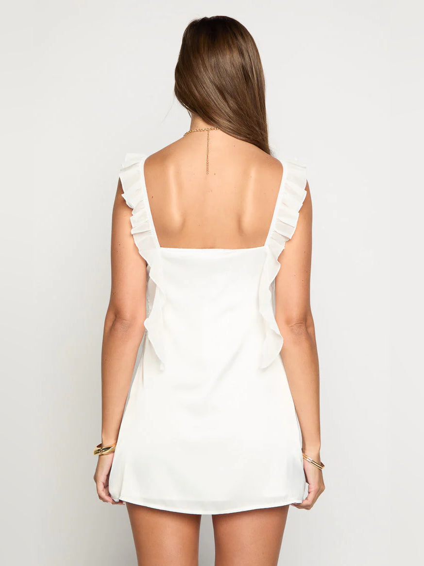 White mini homecoming dress, alternate view showing the skirt and hem