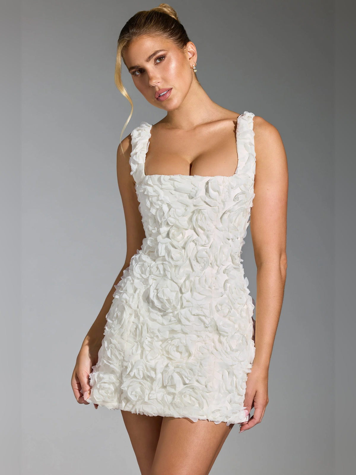 White mini homecoming dress, alternate view showing the skirt and hem