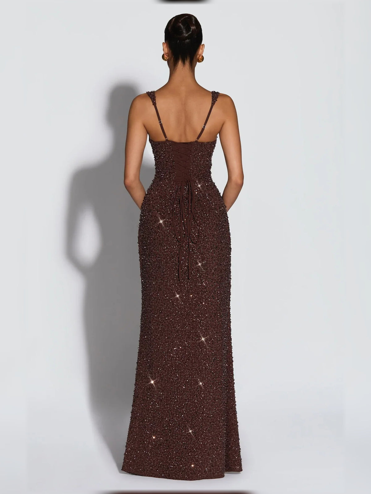 Ivory sheath floor-length formal dress with corset-style bodice, alternate view showing the hem