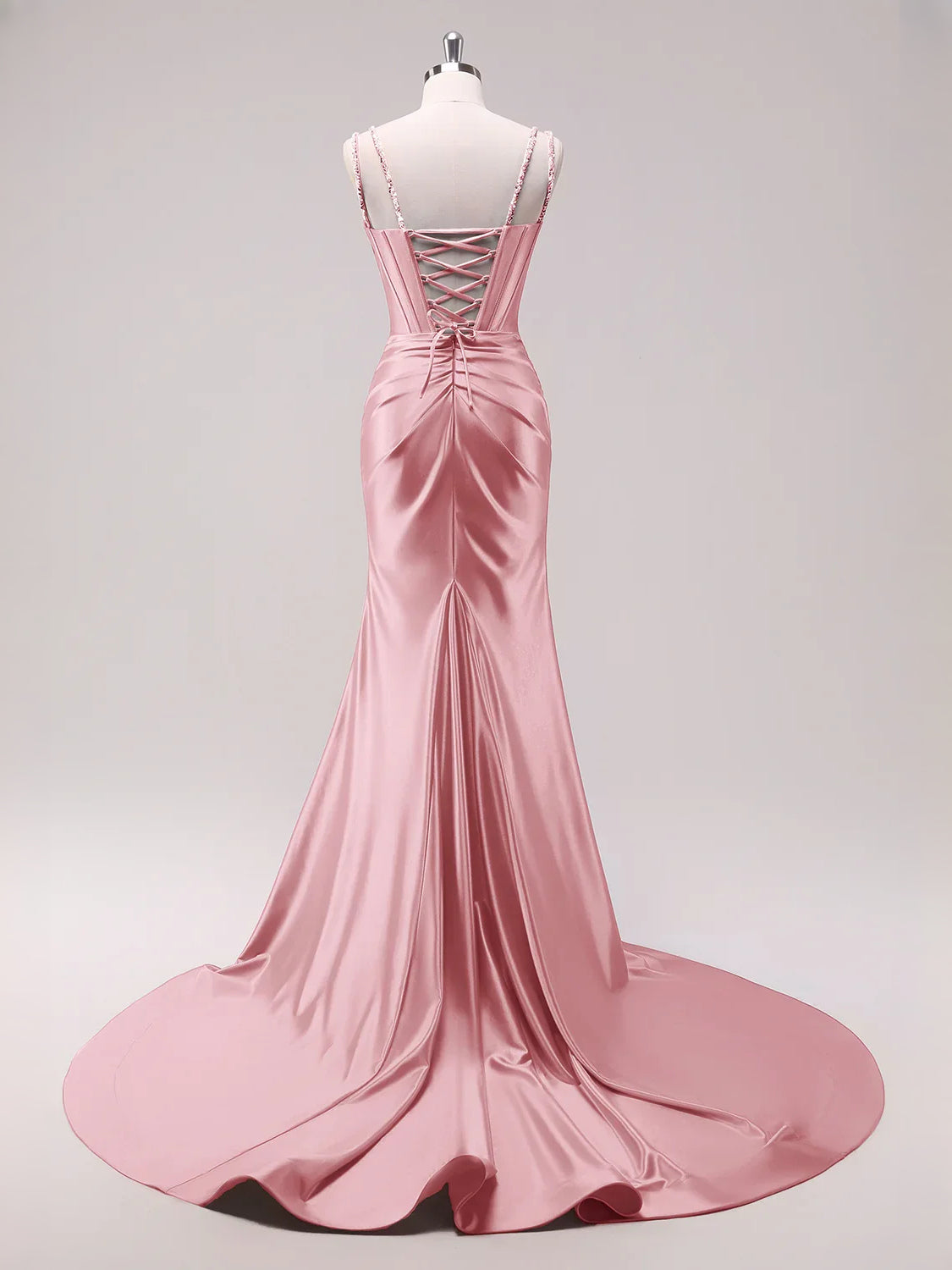 Hot Pink floor-length prom dress, back view showing the rear of the dress showing the garment from a different position