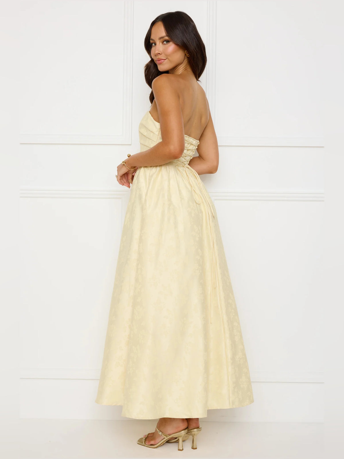 Yellow a-line maxi formal dress with strapless neckline, alternate view showing the hem