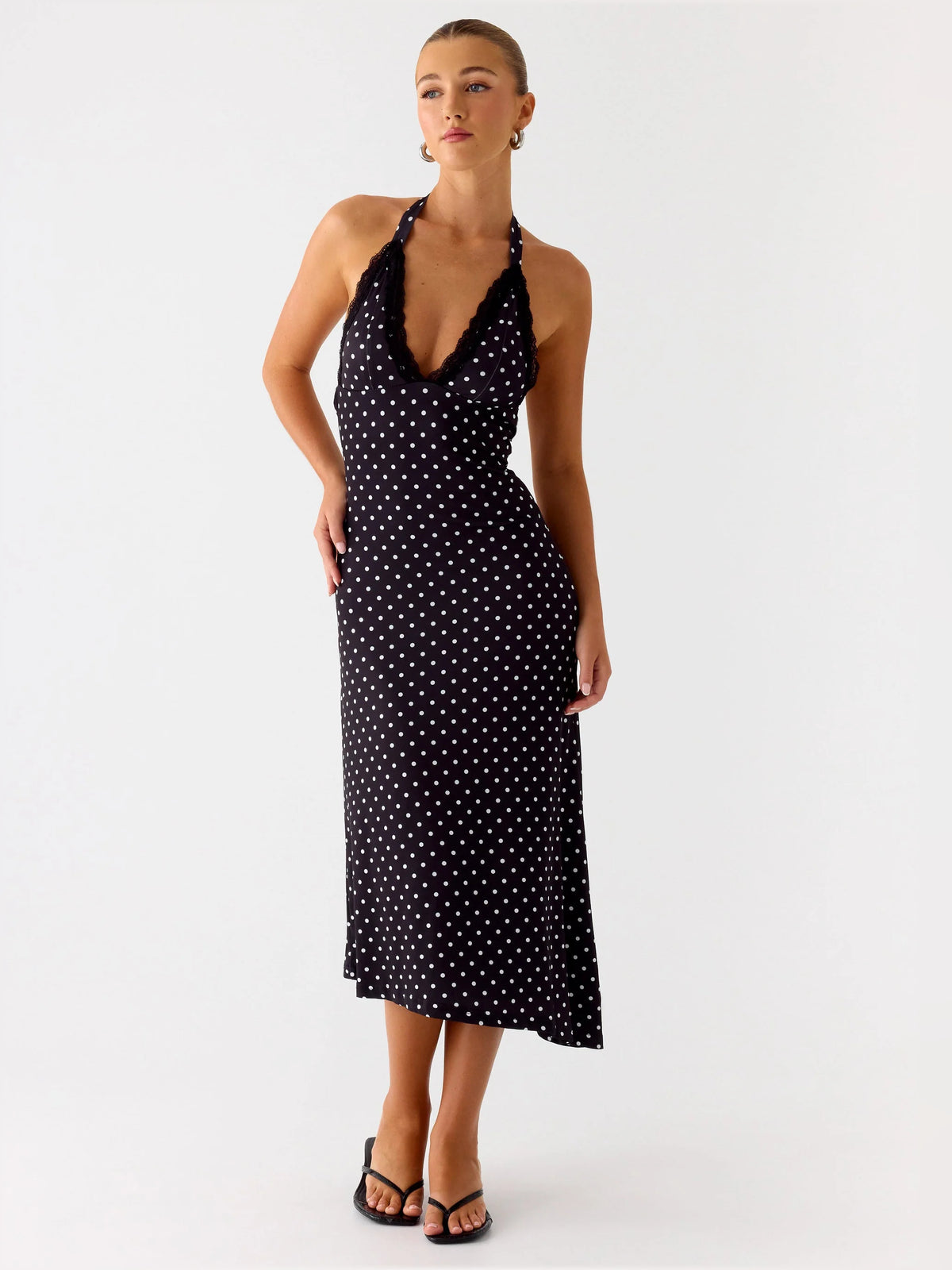 Black midi formal dress with halter neckline, alternate view showing the hem