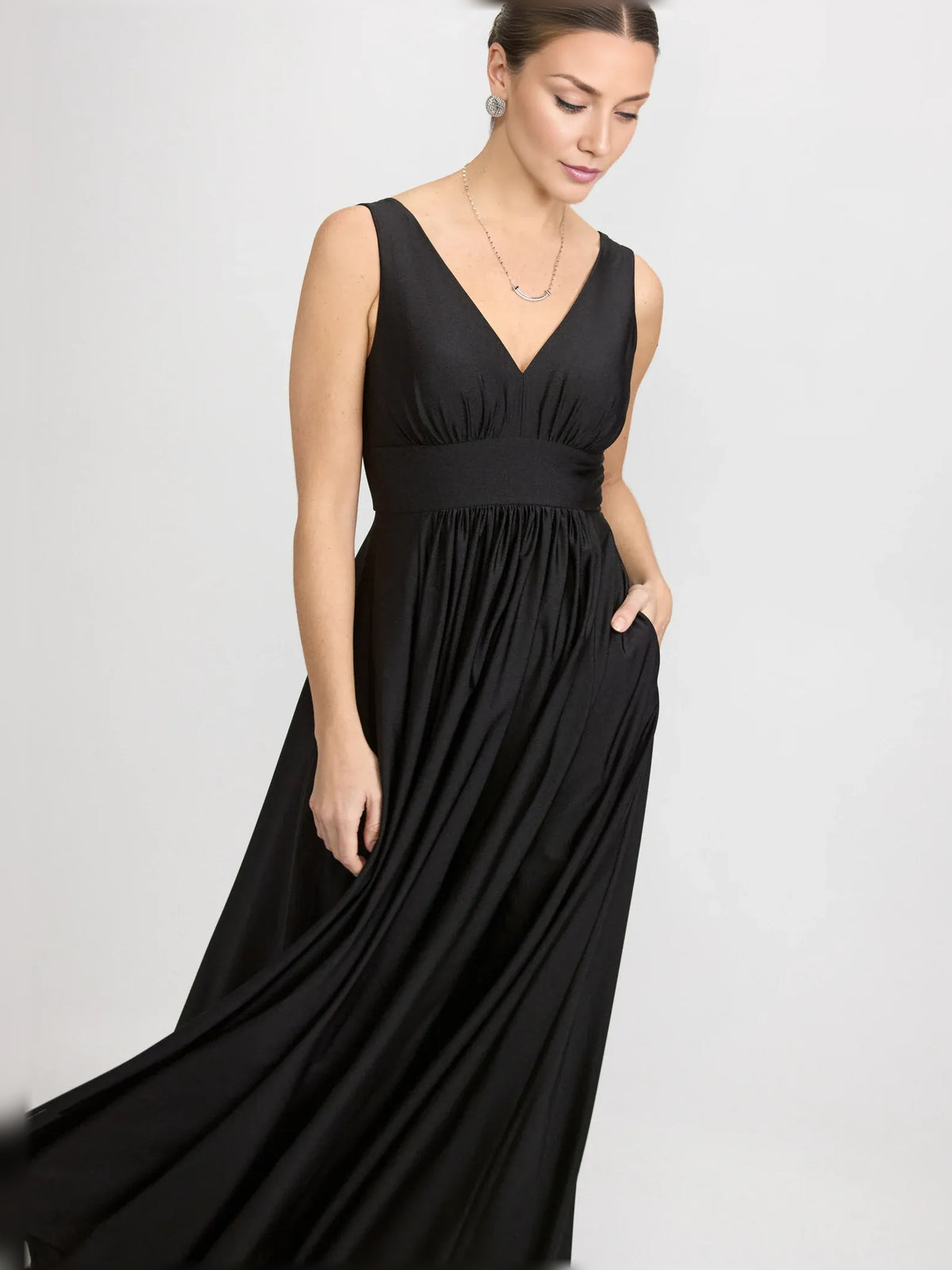 Red a-line floor-length formal dress with skirt slit, alternate view showing the hem