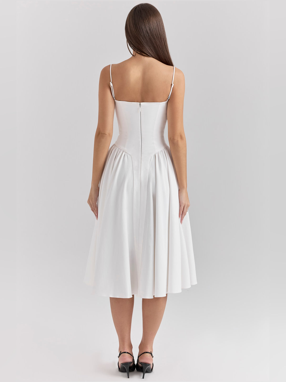 White midi formal dress with corset-style bodice, alternate view showing the hem
